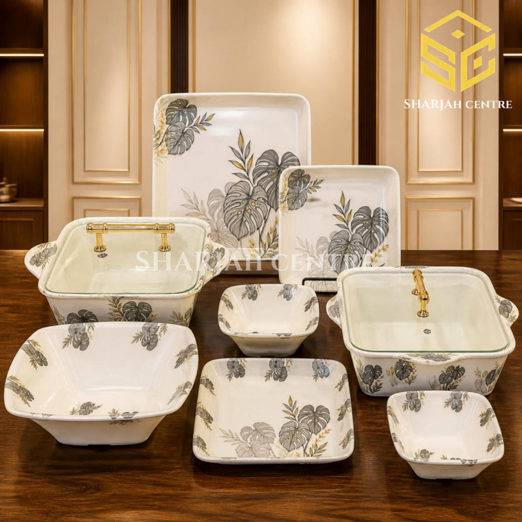 AURA Monstera leaf dinner set, double glazed melamine dinnerware, 72 piece dinner set, melamine plates bowls dishes, grey gold botanical design, luxury wooden table, Sharjah Centre Multan