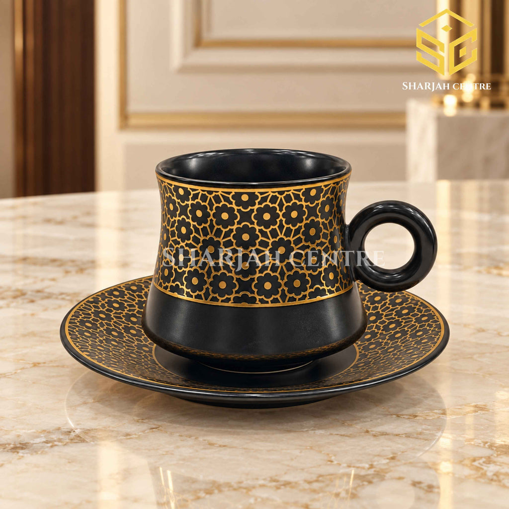 black cup and saucer, gold floral pattern, luxury crockery, marble table setting, Sharjah Centre Multan