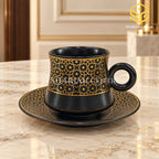 black cup and saucer, gold floral pattern, luxury crockery, marble table setting, Sharjah Centre Multan