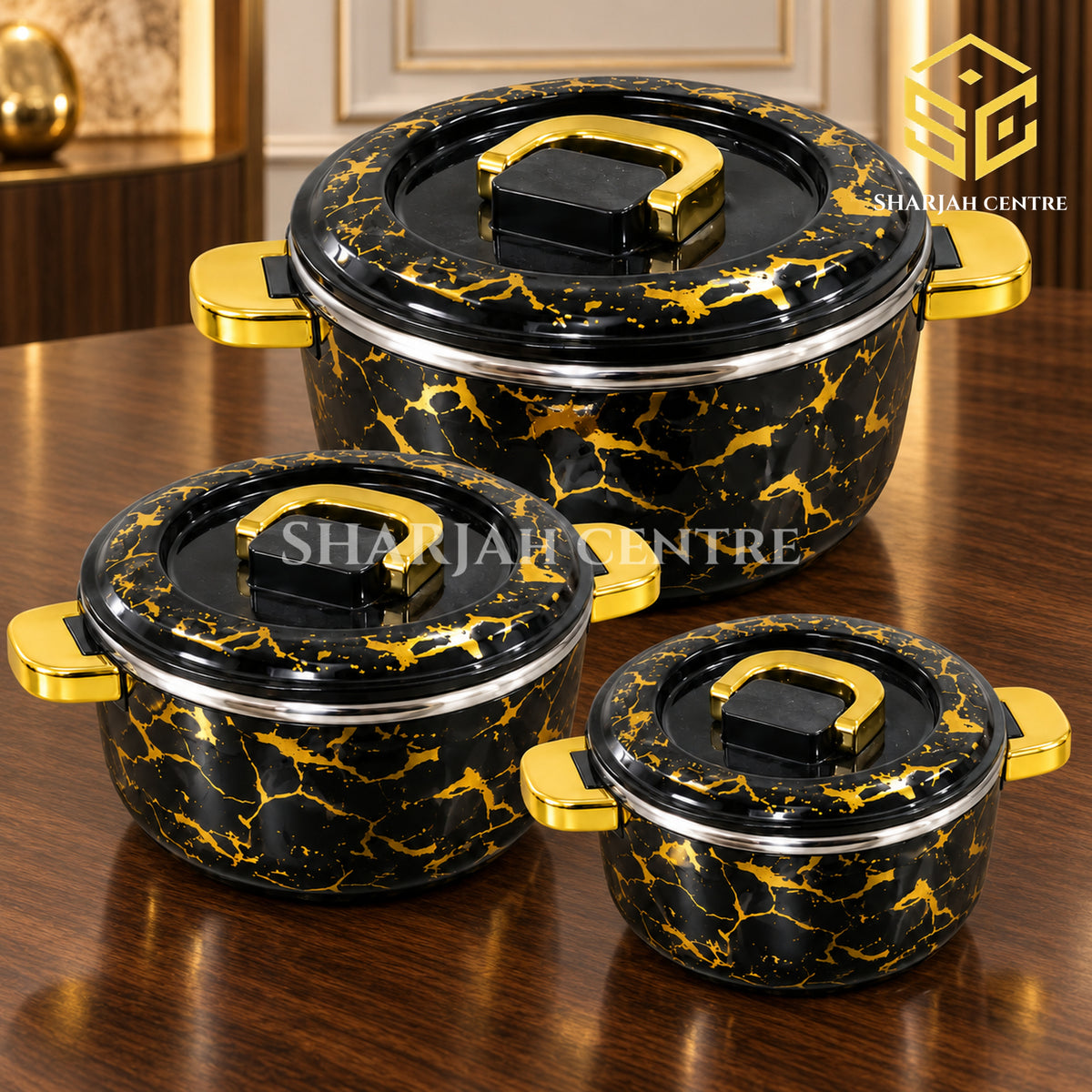 Billi black gold marble hotpot set with gold handles on a luxury walnut table