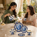 24-piece Super Bone tea set with 6 person serving, blue landscape scenes, floral borders and gold-tone edging model bg