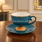 Deep teal cup and saucer, gold detailing, luxury wooden table, premium crockery, Sharjah Centre Multan