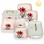 Glamour ivory dinnerware features red lily-style flowers, pink patterned edges and clear lids with gold-tone handles against a white background.