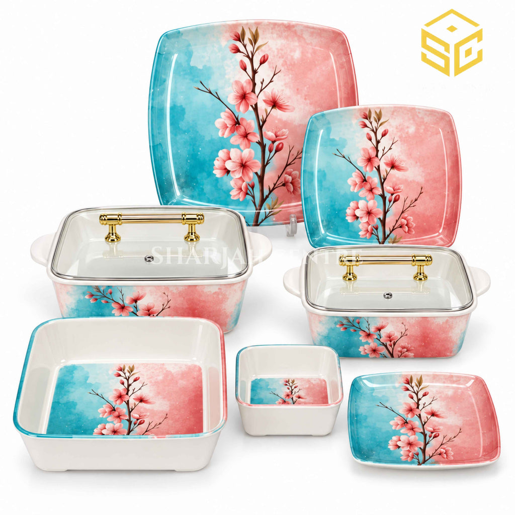 Glamour square dinnerware with pink blossoms on turquoise-and-pink backgrounds is displayed with matching bowls and clear-lidded serving dishes.
