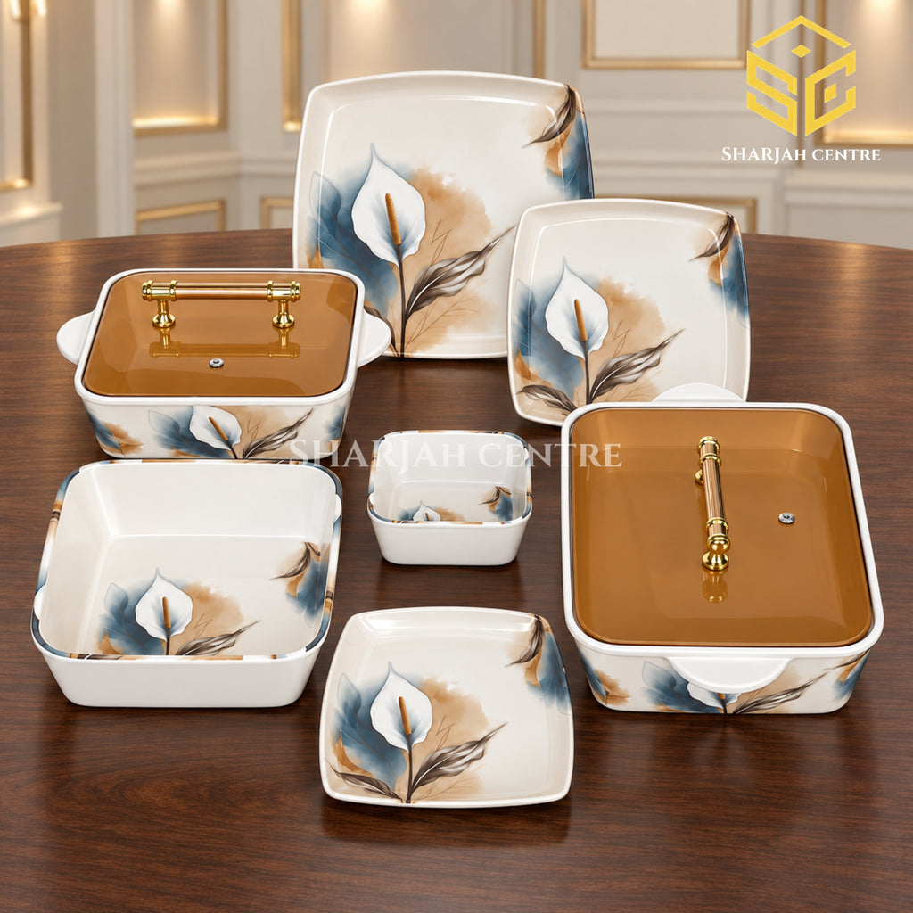 Glamour square dinnerware with white lily flowers, blue accents and amber-lidded serving dishes is arranged against a white background.