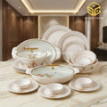 Graceware Nice 16 floral melamine plates and bowls, gold-tone lid handles, cream marble table, warm wooden interior
