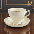 ivory white cup and saucer set of 6, gold rim, gold accent handle, pedestal tea cup, luxury wooden table setting, Sharjah Centre Multan