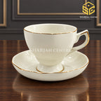 ivory white cup and saucer set of 6, gold rim, gold accent handle, pedestal tea cup, luxury wooden table setting, Sharjah Centre Multan