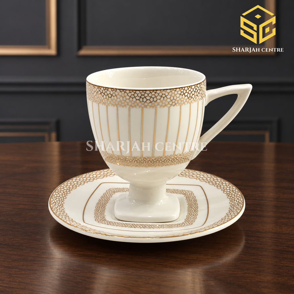 ivory white cup and saucer, gold lattice pattern, pedestal tea cup, luxury wooden table setting, Sharjah Centre Multan