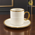 ivory white cup and saucer, full gold handle, metallic gold rim, luxury tea crockery, wooden table setting, Sharjah Centre Multan