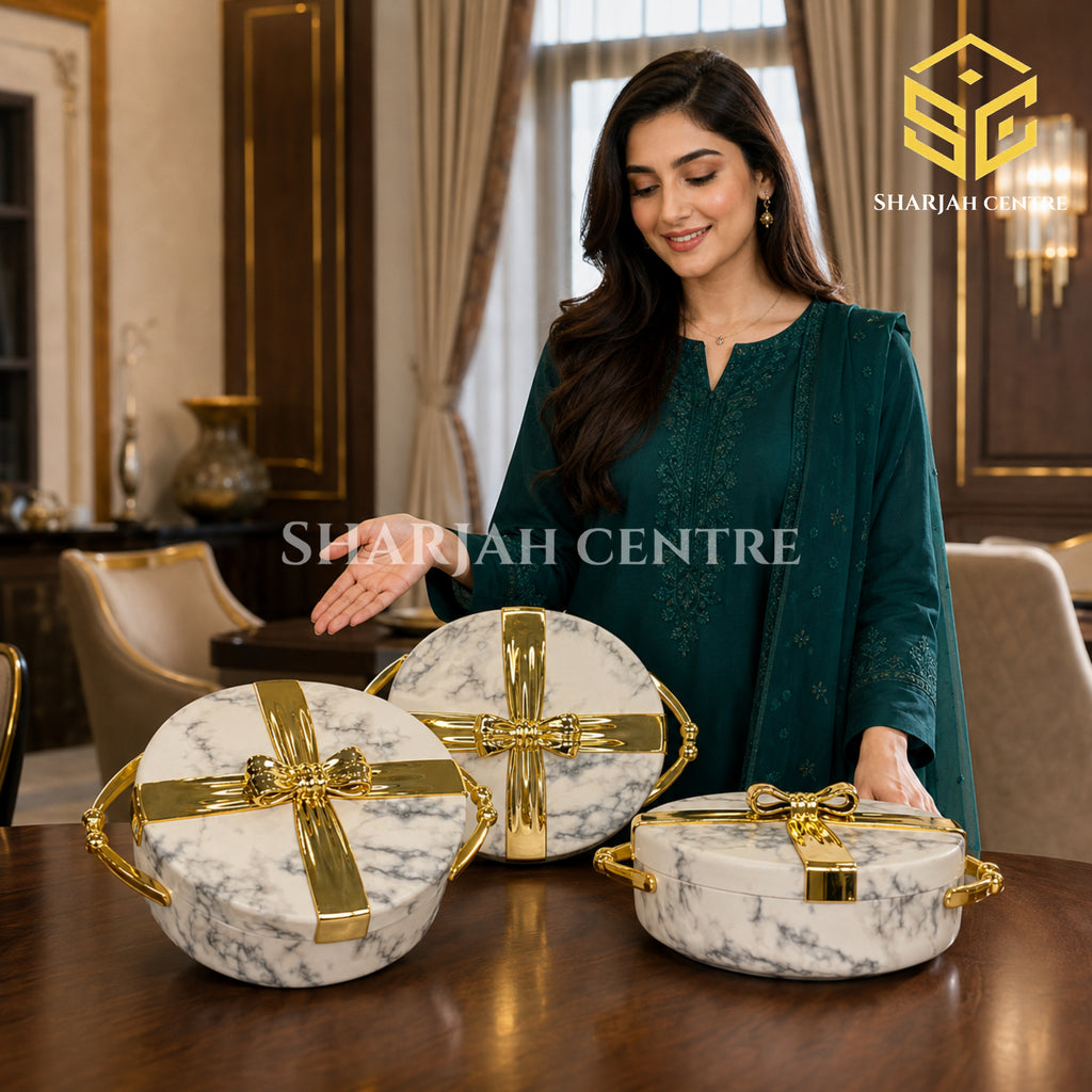 White marble and gold 3-piece hotpot set displayed with a model in a luxury dining interior