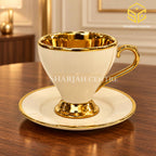 Luxury ivory gold cup and saucer displayed on wooden table – Sharjah Centre