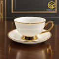 ivory white cup and saucer, gold handle, gold pedestal base, gold rim, luxury tea crockery, Sharjah Centre Multan