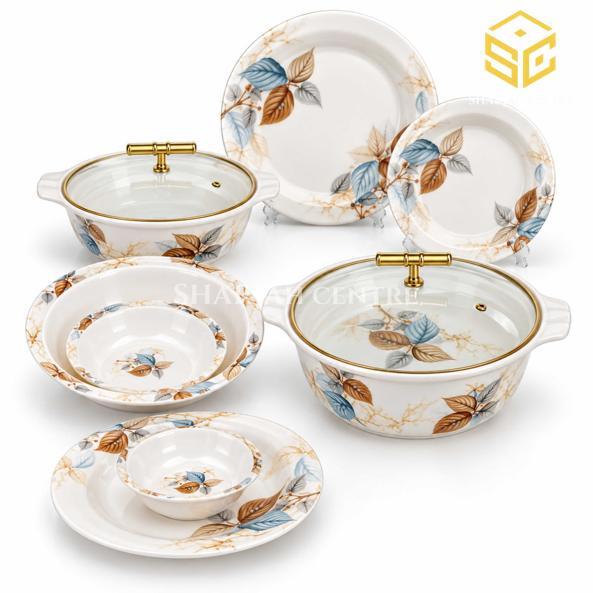Modern round plates, bowls and covered serving dishes display blue and brown leaf patterns against a white background.