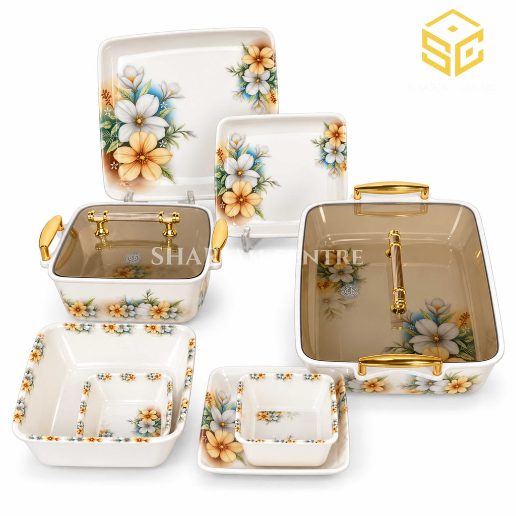 Modern yellow floral square melamine dinner set, matching plates and bowls, amber-brown lids, gold-tone handles, white background