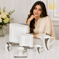 N C England Model 24-piece Super Bone tea set with 6 person serving, square plates and textured silver-tone accents model bg