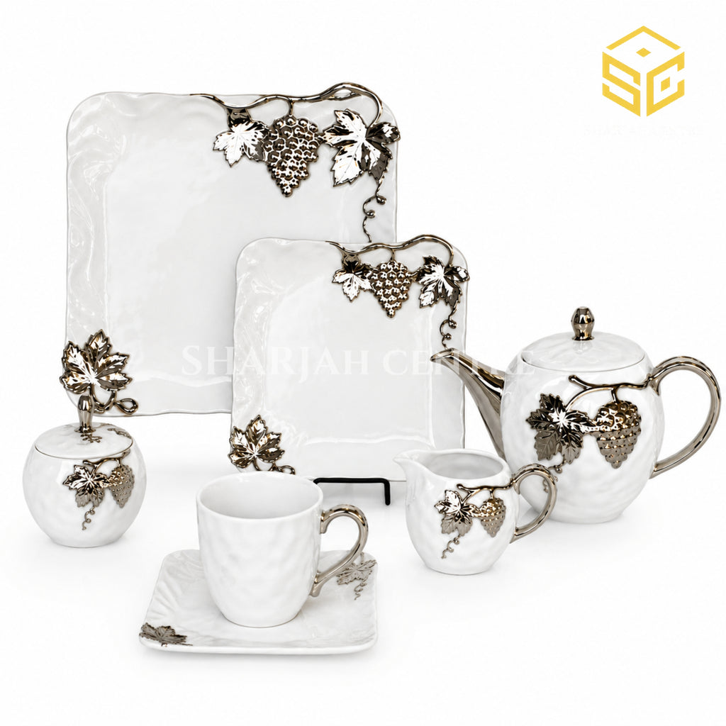 N C England Model 24-piece Super Bone tea set with 6 person serving, square plates and silver grapevine design white bg