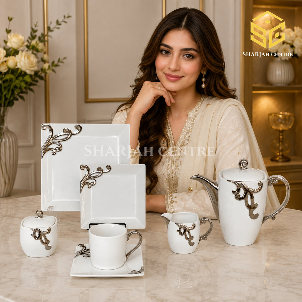 N C England Model 24-piece Super Bone tea set with 6 person serving, square plates and silver-tone scroll detailing model bg