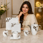 N C England Model 24-piece Super Bone tea set with 6 person serving, square plates and silver-tone scroll detailing model bg