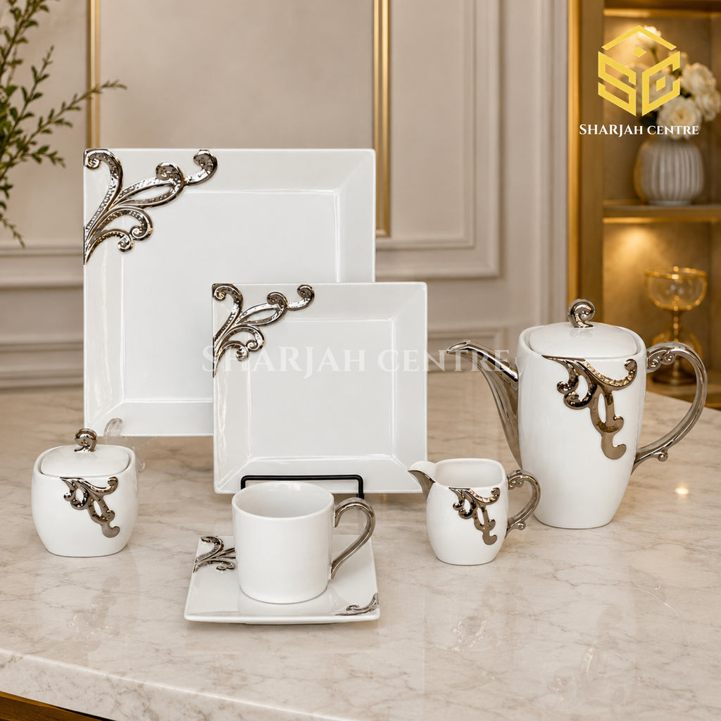 N C England Model 24-piece Super Bone tea set with 6 person serving, square plates and silver-tone scroll detailing color bg