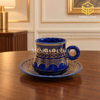 royal blue cup and saucer, ornate gold pattern, luxury tea crockery, wooden table setting, Sharjah Centre Multan