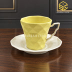 SOOGO lemon yellow cup and saucer, geometric embossed design, luxury wooden table setting, Sharjah Centre Multan
