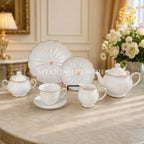 White 24-piece tea set with 6 person serving, embossed wave texture, scalloped edges and gold-tone trim color bg