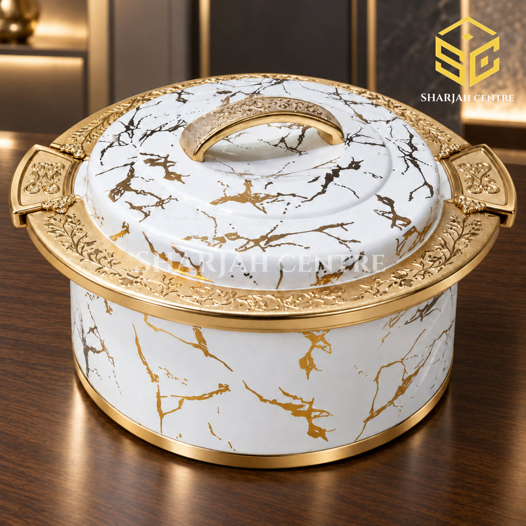 Ornate white marble and gold insulated hotpot displayed in a luxury interior